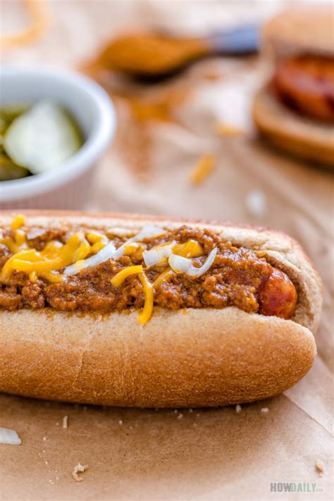 Easy hot dog sauce - 4 cups water 1-1/2 pounds ground beef 1 medium onion, chopped 1 can (28 ounces) tomato sauce 2 tablespoons brown sugar 1-1/2 teaspoons chili powder 1/2 teaspoon salt 1/4 teaspoon pepper Hot dogs, heated Hot dog buns, split Directions In a large saucepan, bring water to a boil. Carefully crumble beef into water. Add onion.